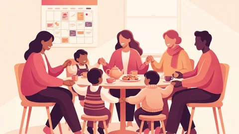 Three adults and two children sit around a kitchen table holding hands, with a color-coded family calendar on the wall.